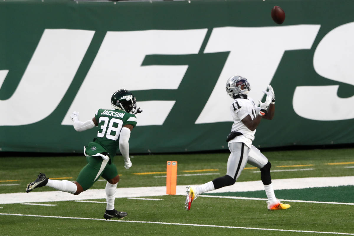 Las Vegas Raiders' Henry Ruggs III, right, catches a touchdown during the second half an NFL fo ...