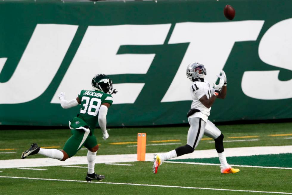 Las Vegas Raiders' Henry Ruggs III, right, catches a touchdown during the second half an NFL fo ...