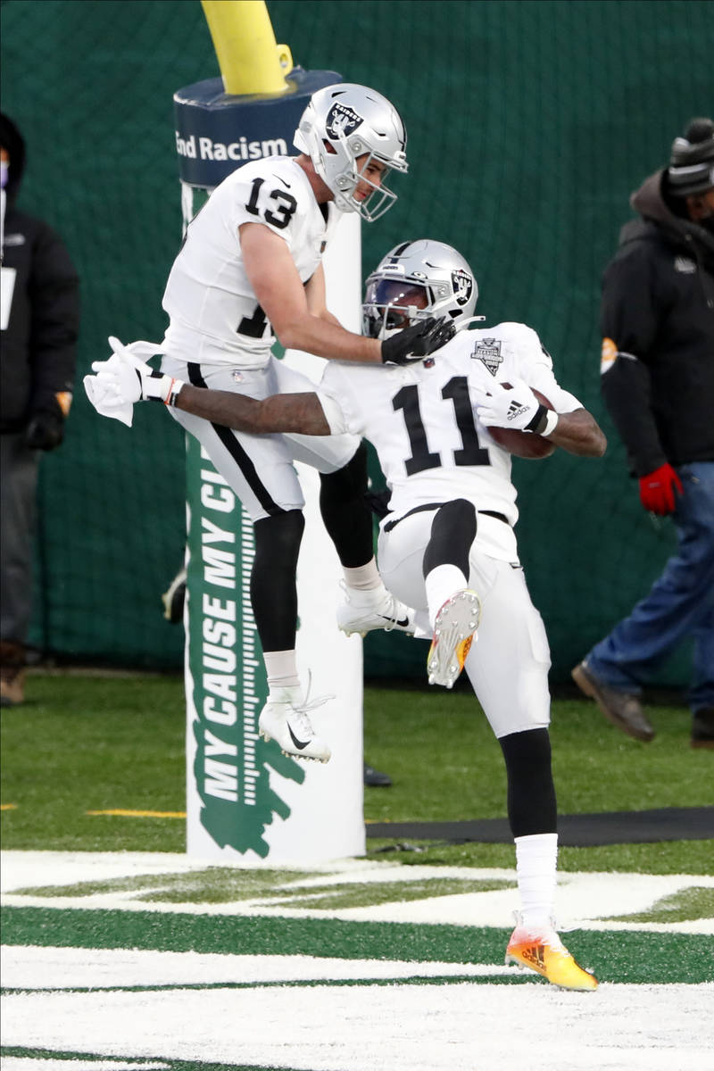 Las Vegas Raiders' Henry Ruggs III, right, celebrates his touchdown with Hunter Renfrow during ...
