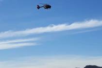 A Las Vegas Metropolitan Police Department leaves the Shadow Mountain area after two hikers wer ...