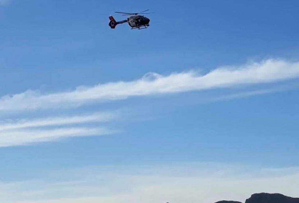 A Las Vegas Metropolitan Police Department leaves the Shadow Mountain area after two hikers wer ...