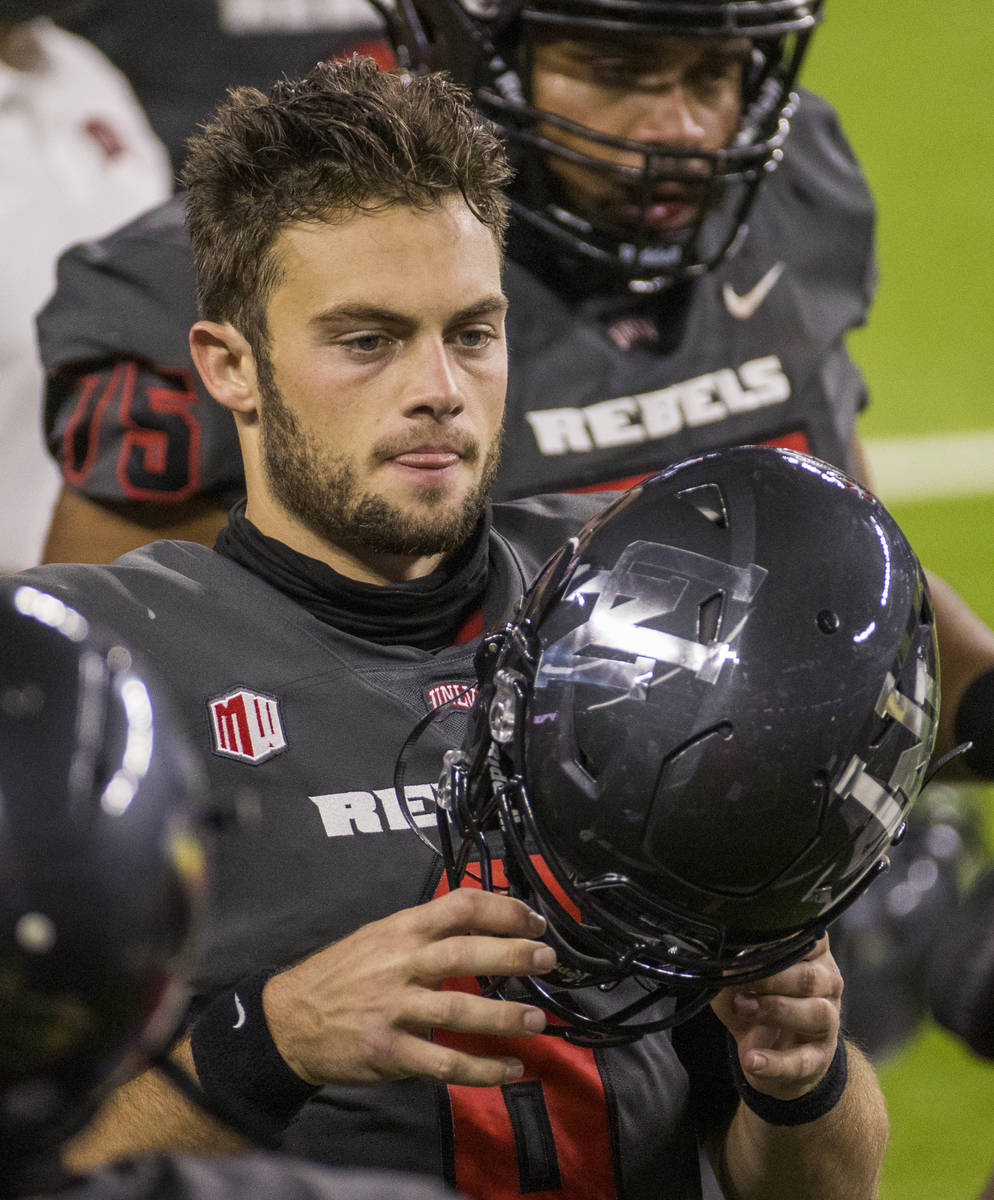 UNLV Rebels quarterback Max Gilliam (6) readies to take the field again versus the Nevada Wolf ...