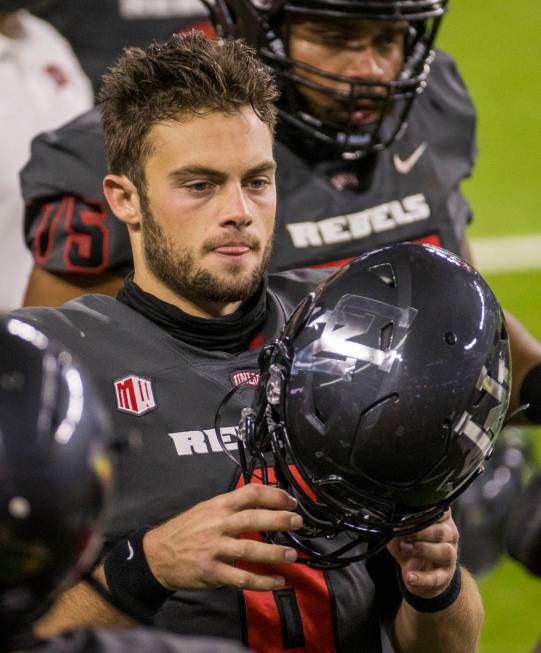 UNLV Rebels quarterback Max Gilliam (6) readies to take the field again versus the Nevada Wolf ...