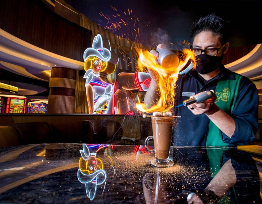 Bartender Anthony Wu prepares a Campfire Hot Chocolate at Vegas Vickie's Cocktail Lounge at Cir ...