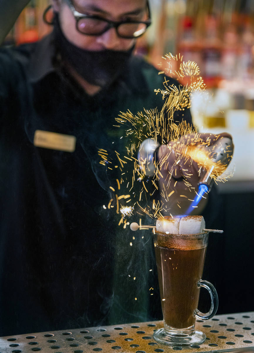 Bartender Anthony Wu prepares a Campfire Hot Chocolate at Vegas Vickie's Cocktail Lounge at Cir ...