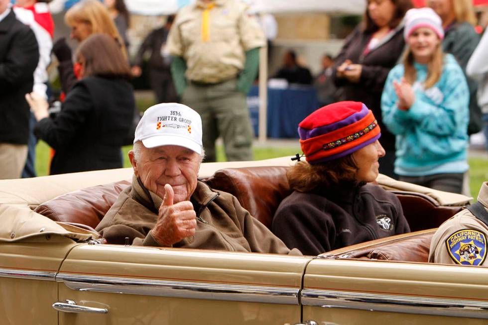 Retired Air Force Brig. Gen. Chuck Yeager gives a thumbs up to the crowd during the Veterans Da ...