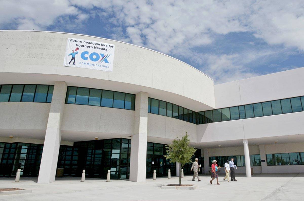 Patrons walk out of the new headquarters for Cox Communications in Las Vegas on Vegas Drive nea ...