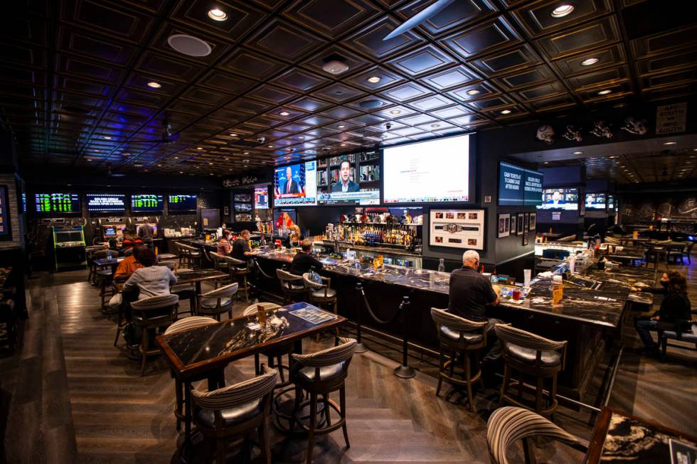 People dine, drink and play bartop gaming machines at the Golden Circle Sportsbook and Bar at T ...