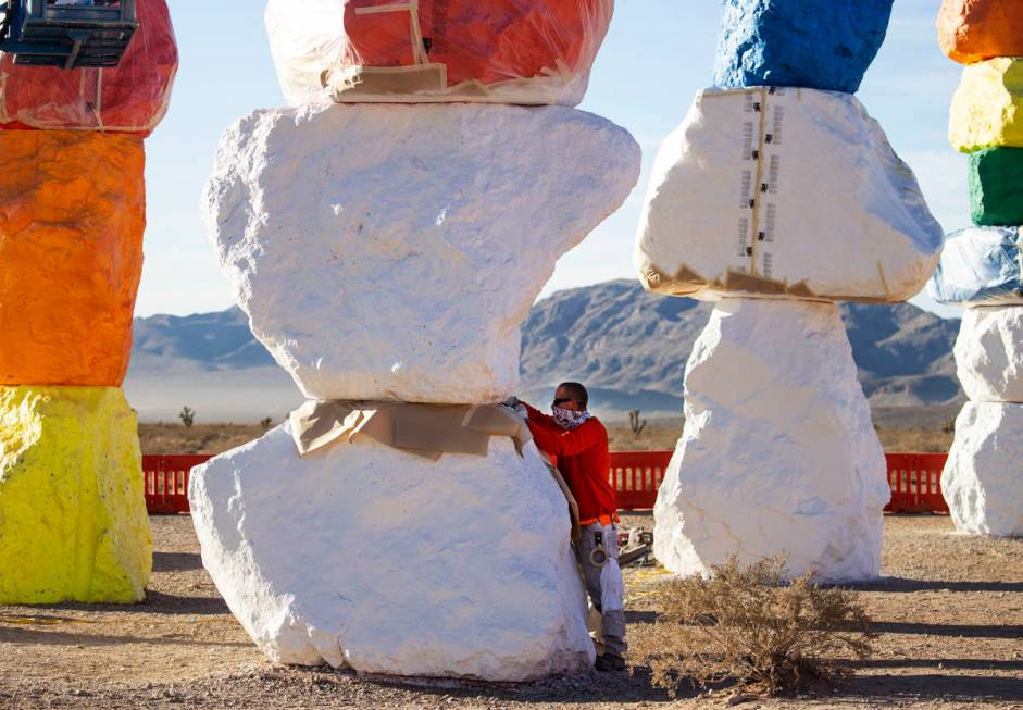 Marty Mimms of Vergith Contracting Co. begins prepping the Seven Magic Mountains totems for pai ...