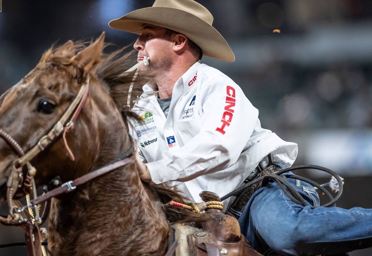 Hunter Herrin rides during the 7th go-round of the National Finals Rodeo in Arlington, Texas, o ...