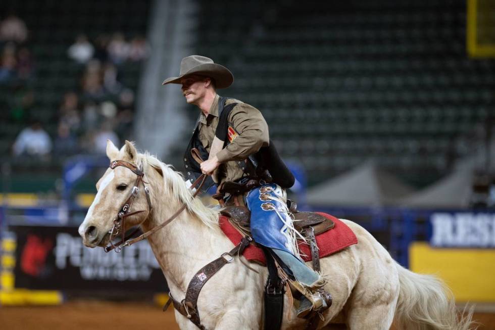 Orin Larsen performs during the 7th go-round of the National Finals Rodeo in Arlington, Texas, ...