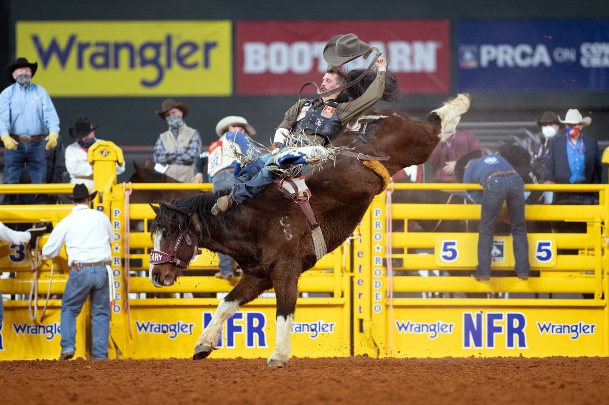 Orin Larsen rides during the 7th go-round of the National Finals Rodeo in Arlington, Texas, on ...