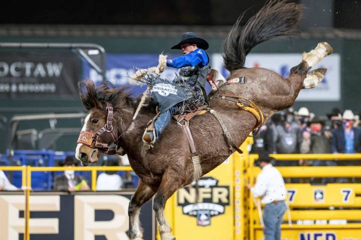 Stetson Wright rides during the 7th go-round of the National Finals Rodeo in Arlington, Texas, ...