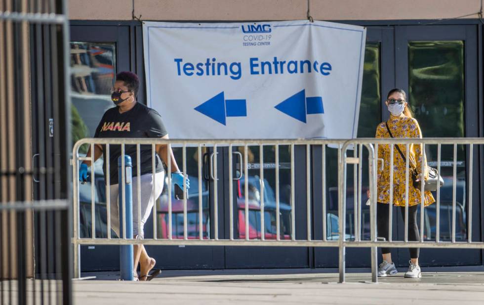 People enter the walk-up COVID-19 testing offered at Cashman Center in partnership with Univers ...