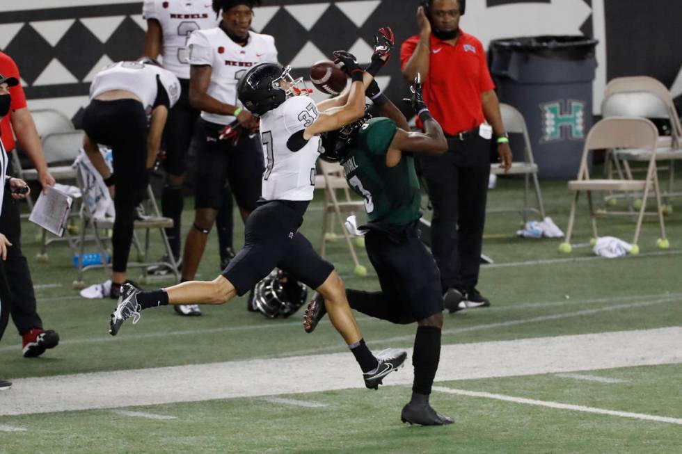 UNLV defensive back Daniel Walden (37) breaks up a pass intended for Hawaii wide receiver Melqu ...