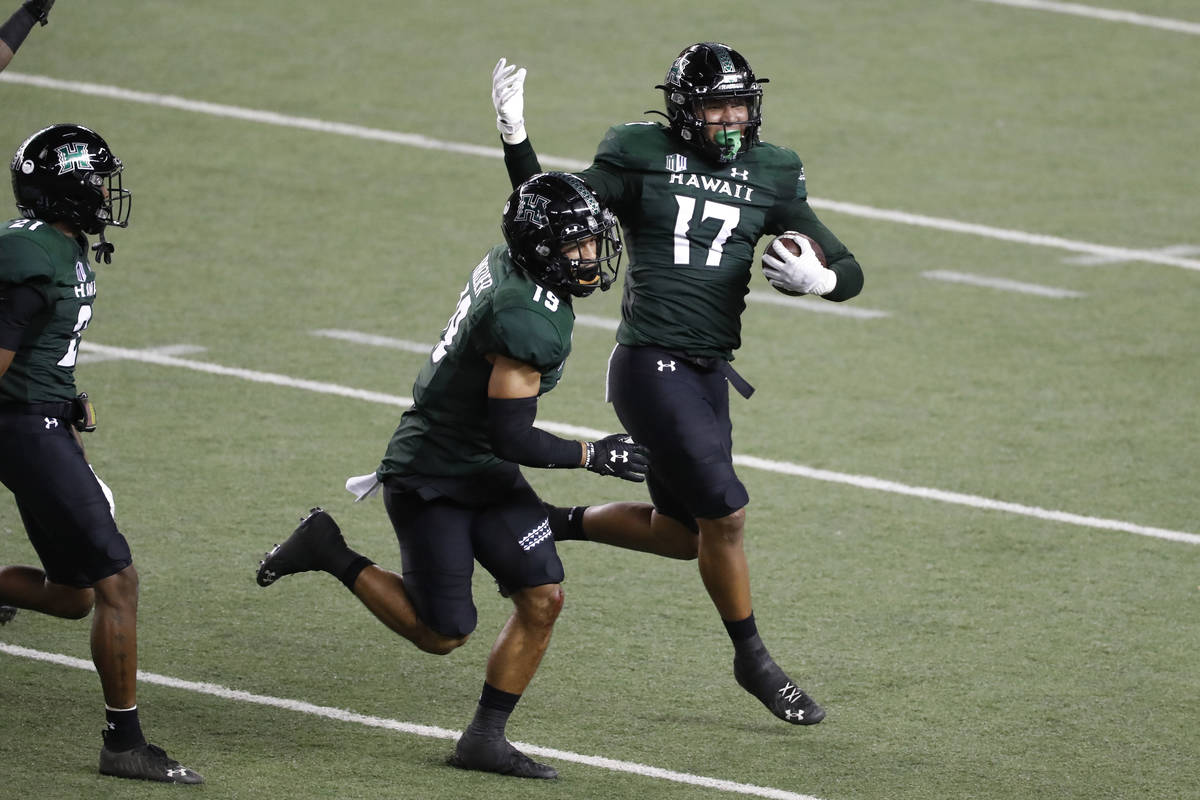 Hawaii linebacker Isaiah Tufaga (17) celebrates his fumble recovery against UNLV during the fir ...