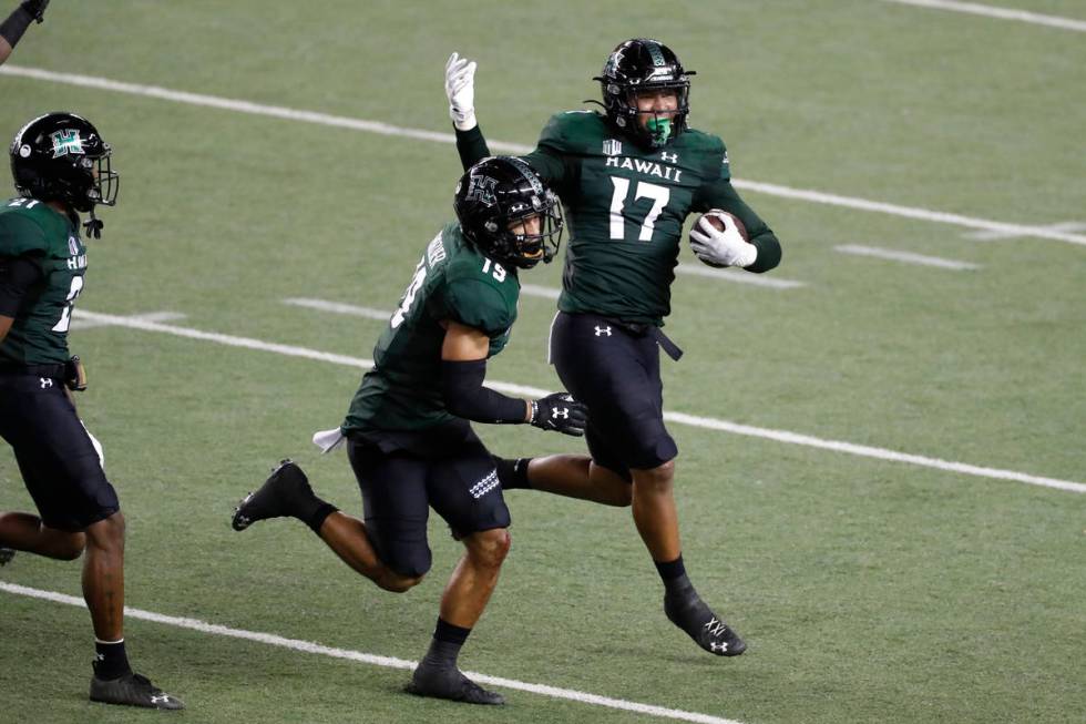 Hawaii linebacker Isaiah Tufaga (17) celebrates his fumble recovery against UNLV during the fir ...