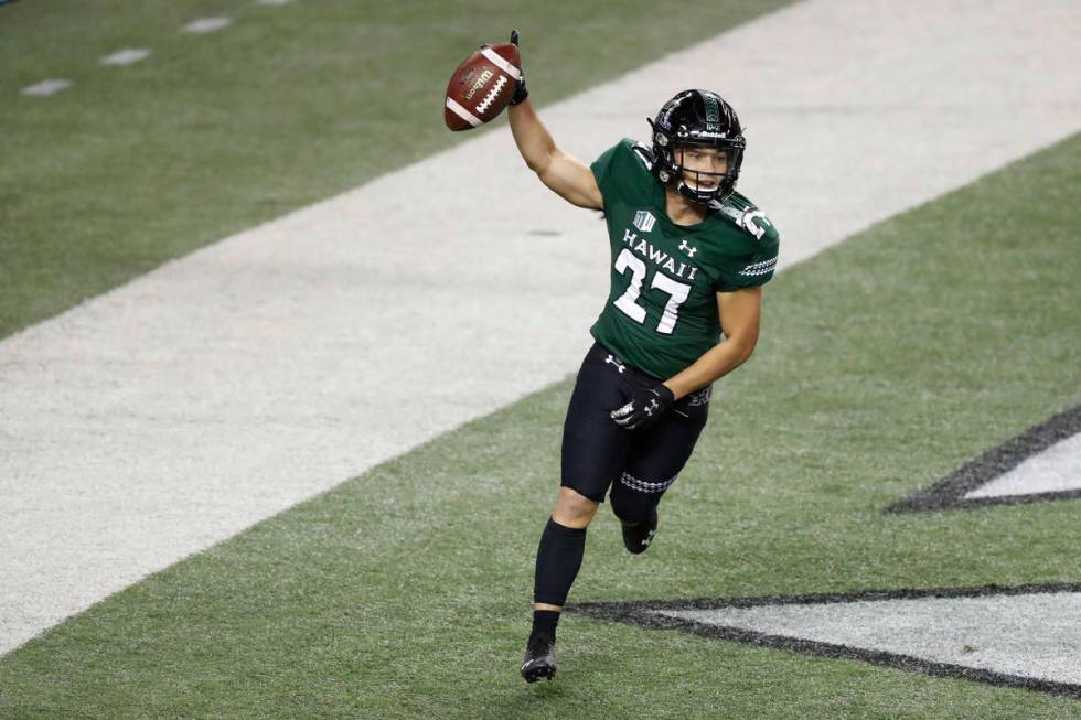 Hawaii running back Koali Nishigaya (27) reacts after making a touchdown against UNLV in the se ...