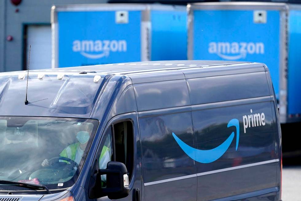FILE - In this Oct. 1, 2020 file photo, an Amazon Prime logo appears on the side of a delivery ...