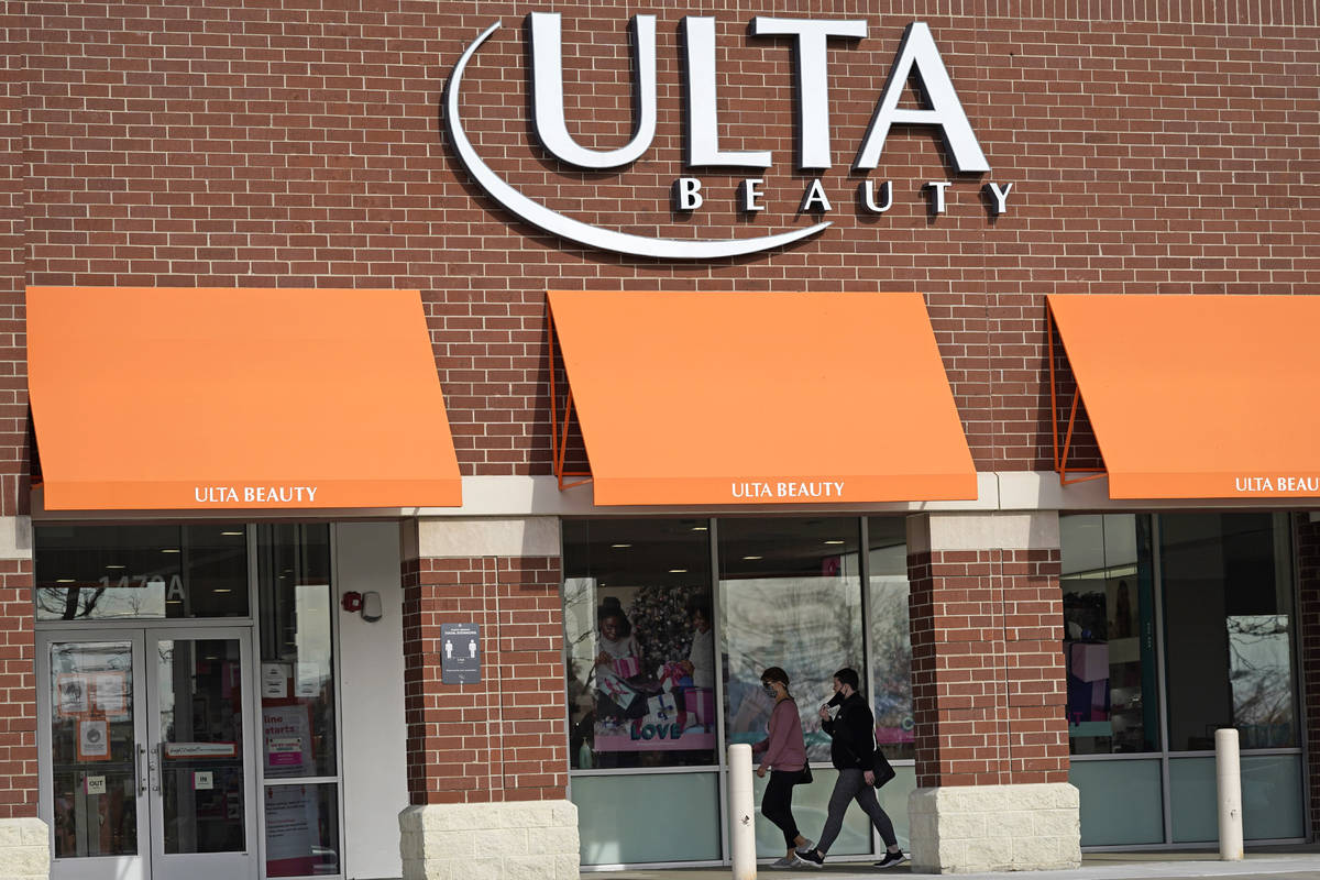 FILE - In this Nov. 5, 2020 file photo, women walk to an Ulta Beauty store in Schaumburg, Ill. ...