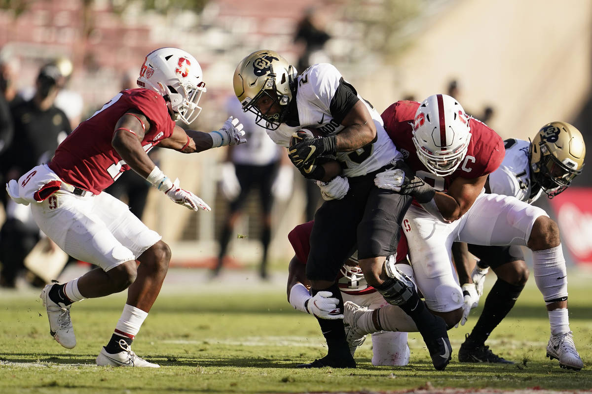 Colorado running back Jarek Broussard, center, runs against Stanford during the second half of ...