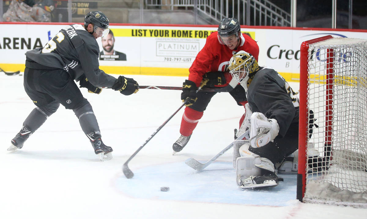 In this Sept. 6, 2019, file photo, Vegas Golden Knights defender Kaedan Korczak, from left, for ...