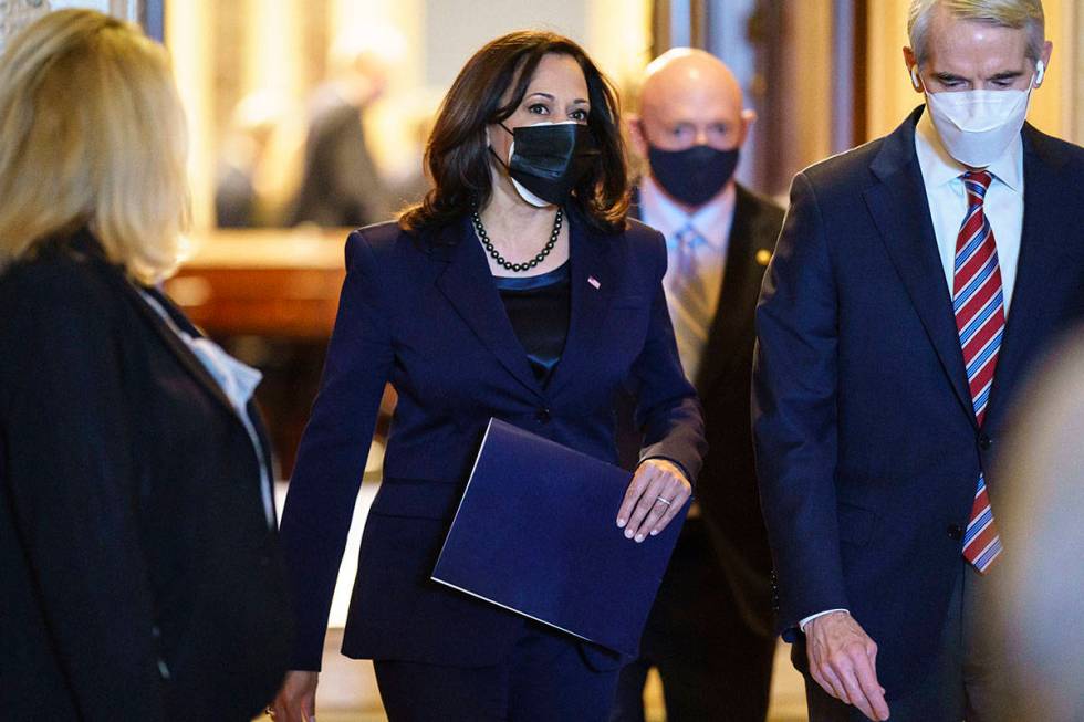 Vice President-elect Sen. Kamala D. Harris, D-Calif., with Sen. Rob Portman, R-Ohio, right, dep ...