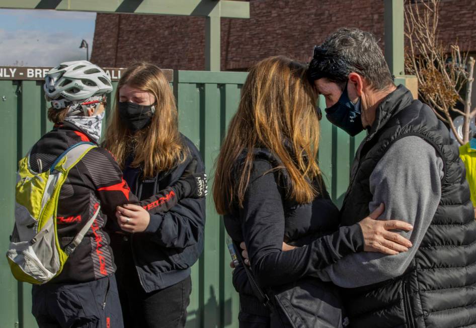 Pat Treichel with Ghost Bikes, right, comforts Angela Ahmet with others nearby during a vigil h ...
