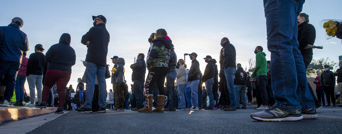 Attendees listen to kind words offered by family and friends during a vigil honoring the lives ...