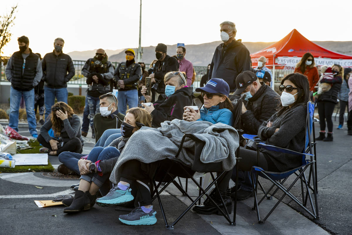 Family members listen to others speaking kind words during a vigil honoring the lives of five L ...