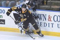 In this January 5, 2019, photo, Green Bay Gamblers forward Brendan Brisson (20) avoids a check ...