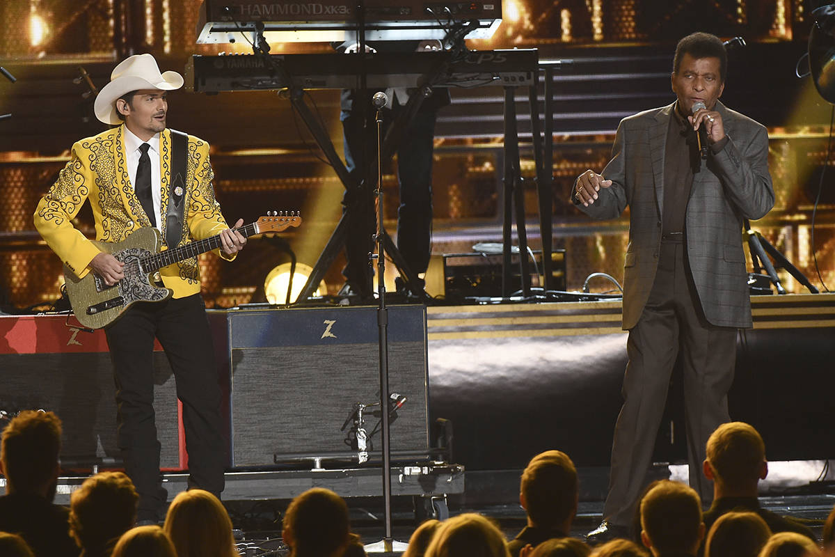 Brad Paisley, left, and Charley Pride perform "Kiss An Angel Good Morning" at the 50t ...