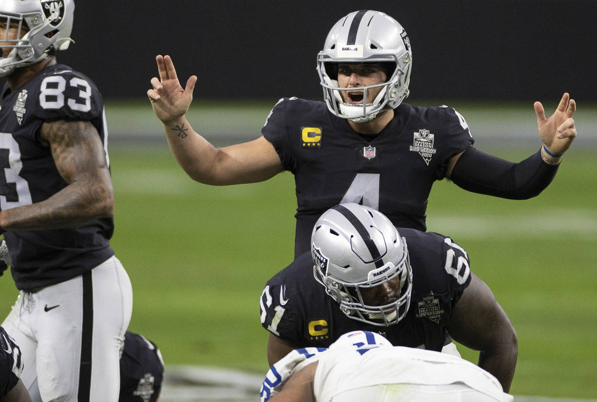 Raiders quarterback Derek Carr (4) calls an audible in the third quarter during an NFL football ...