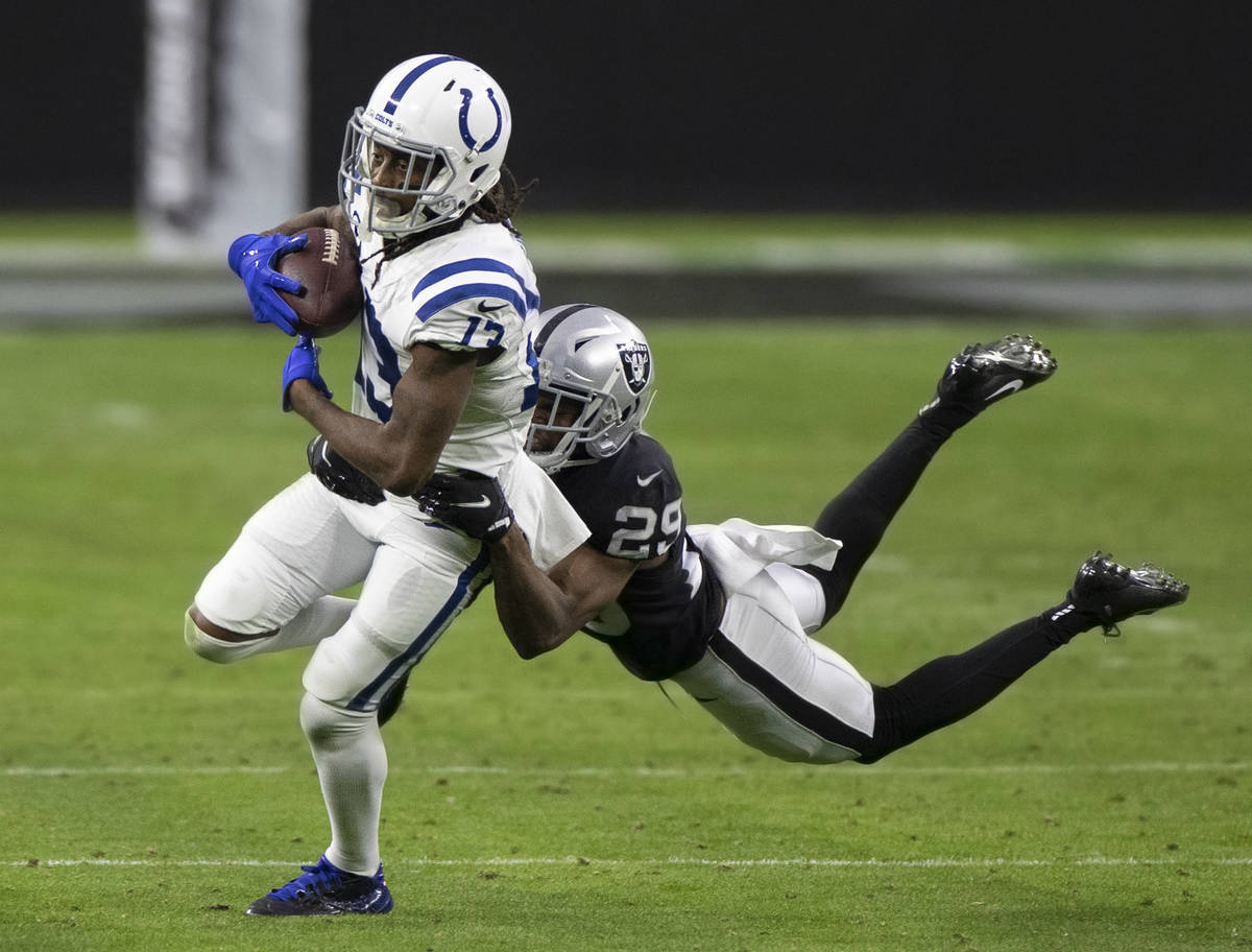 Indianapolis Colts wide receiver T.Y. Hilton (13) makes a catch with Raiders free safety Lamarc ...