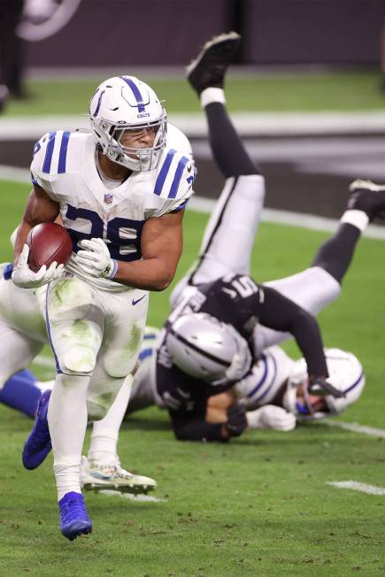 Indianapolis Colts running back Jonathan Taylor (28) runs the ball for a touchdown in the fourt ...