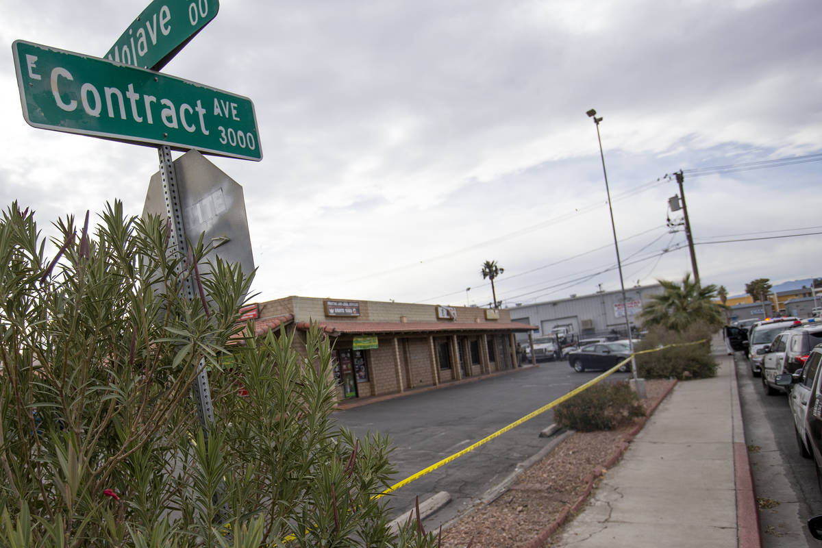 Metropolitan police investigate a homicide in the 3000 block of Contract Avenue on Sunday, Dec. ...