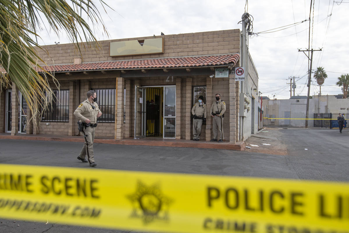 Metropolitan police investigate a homicide in the 3000 block of Contract Avenue on Sunday, Dec. ...