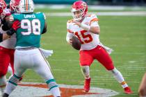 Kansas City Chiefs quarterback Patrick Mahomes (15) scrambles with the ball against Miami Dolph ...