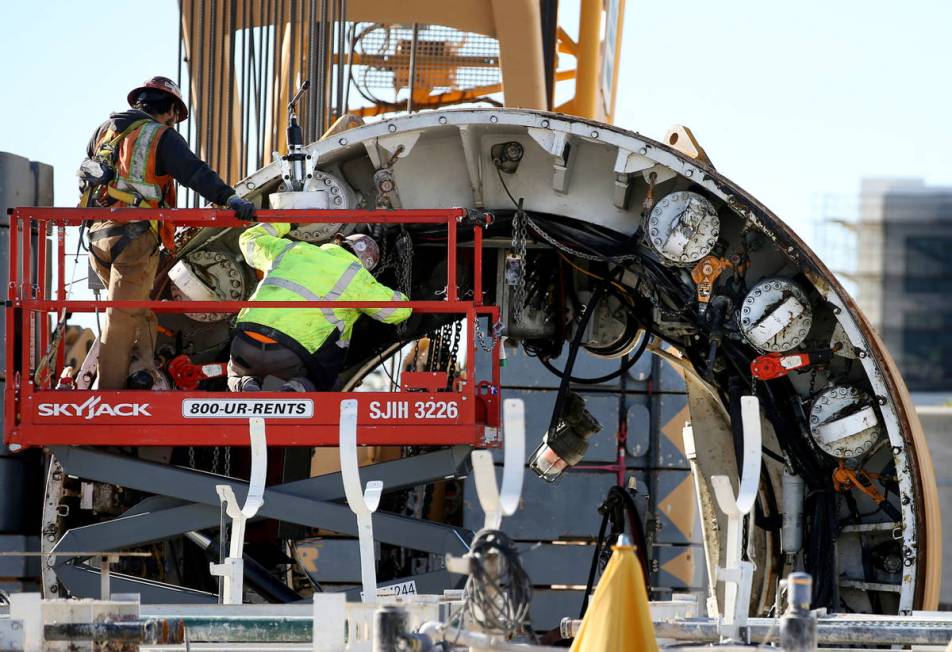 The Boring Co. workers prepare to lower the drill assembly to begin work on the second tunnel i ...