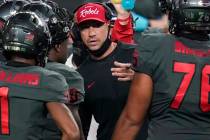 UNLV head coach Marcus Arroyo speaks with his players during the second half of an NCAA college ...