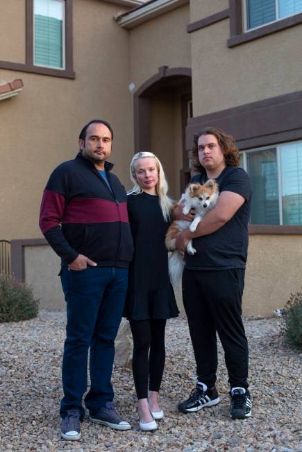 Couple Amit Malik, left, and Klara Turan, center, stand for a portrait with Klara's brother And ...