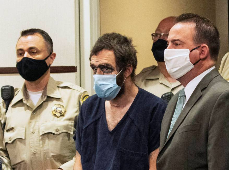 Christopher McDonnell, center, one of three people charged in a shooting spree in Henderson and ...