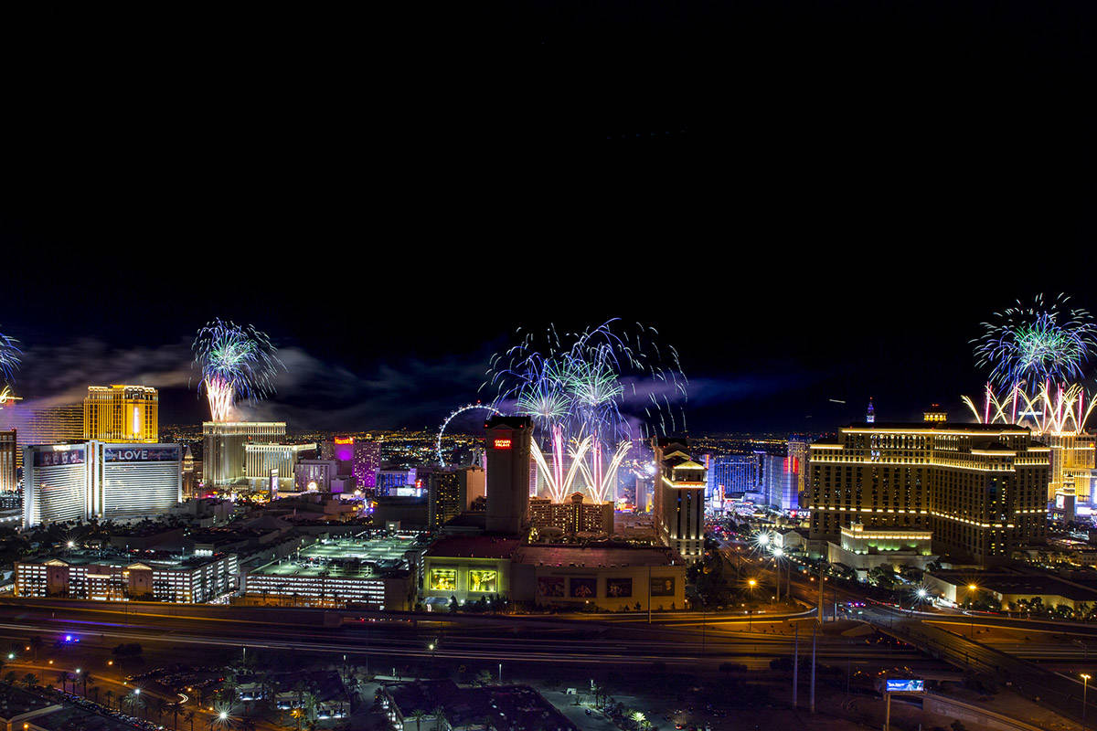 Fireworks for New Year's Eve erupt over the Strip as viewed from the VooDoo Rooftop Nightclub & ...