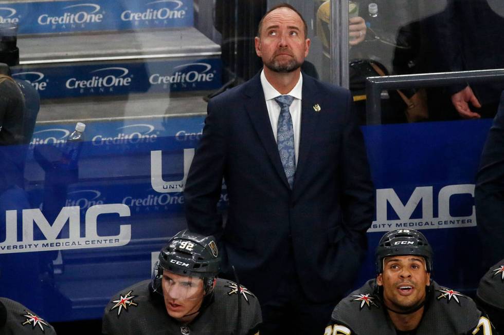 Vegas Golden Knights head coach Pete DeBoer looks up at the display board in the second period ...