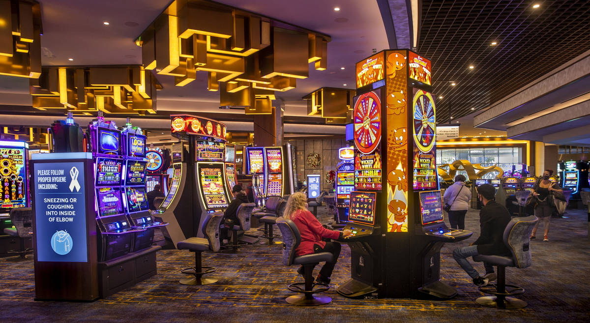 A few slot machines are being played on the casino floor at the Strat on Wednesday, Dec. 23, 20 ...