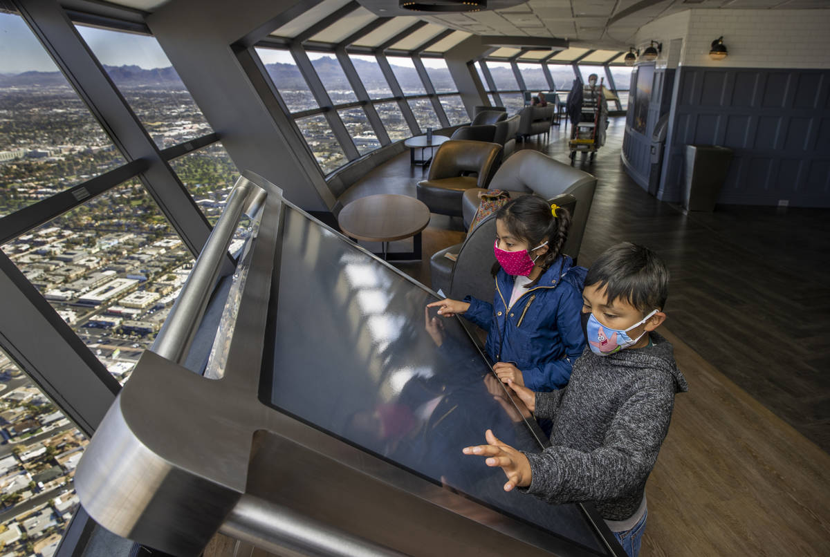 Janet, 10, and Ulysses Martinez, 8, check out one of the new interactive maps on locations abou ...