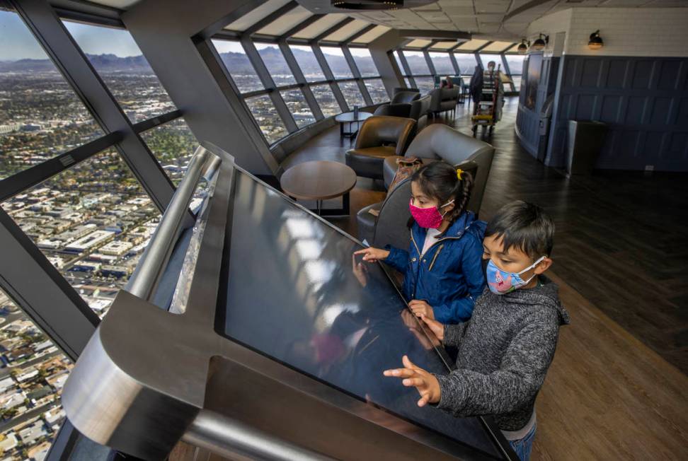 Janet, 10, and Ulysses Martinez, 8, check out one of the new interactive maps on locations abou ...