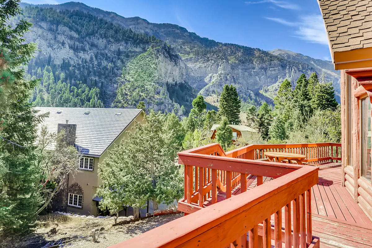 Mt. Charleston Realty The cabin's decks overlook the forested backdrop of Toiyabe National Fore ...