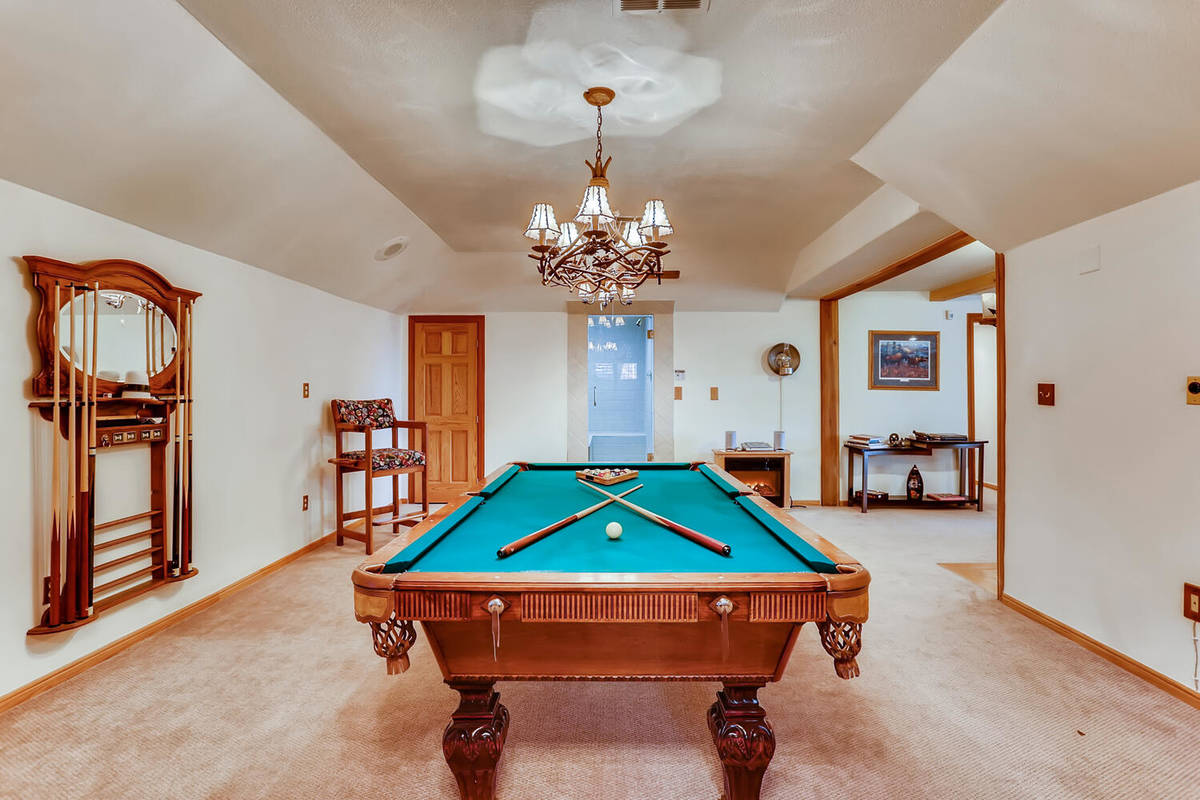 Mt. Charleston Realty The 3,728-square-foot, custom log cabin features a game room.