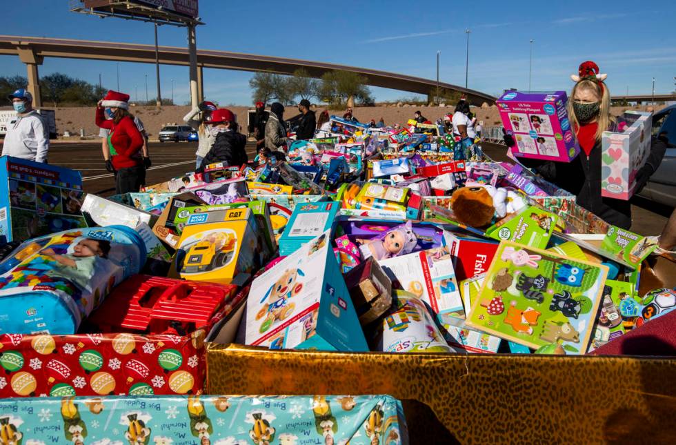 Boxes of toys for all kidÕs ages are ready to be given out by volunteers as the Las Vegas ...